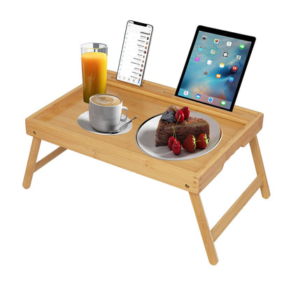 Medium bamboo bed tray table with handles, folding legs, media slot, used as a breakfast, snack, or laptop tray for serving.