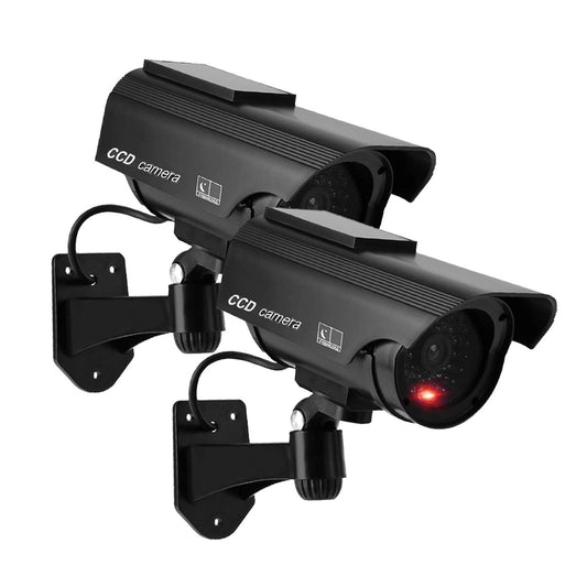 Black solar-powered dummy CCTV dome camera with flashing red LED light, suitable for indoor and outdoor security, with warning sticker.