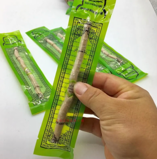 Natural Miswak tooth cleaning stick from BackupMyFilesNow.com, showing the wooden stick used for oral hygiene.