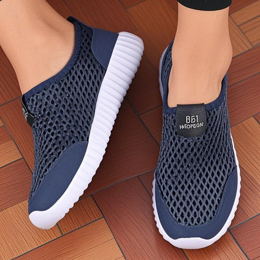 Navy blue women's slip-on mesh shoes by BackupMyFilesNow.com, lightweight, fashionable walking and hiking footwear for easy wear.