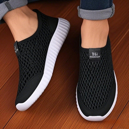Navy blue women's slip-on mesh shoes by BackupMyFilesNow.com, lightweight, fashionable walking and hiking shoes for easy wear.