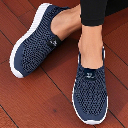 Navy blue women’s slip-on mesh walking shoes by BackupMyFilesNow.com, lightweight and fashionable for easy daily wear and hiking.