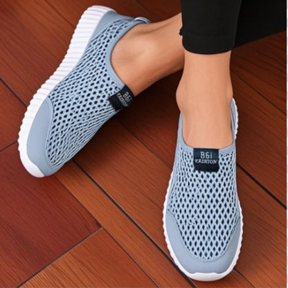 Navy blue women's slip-on mesh walking shoes from BackupMyFilesNow.com, lightweight and fashionable for easy casual wear and hiking.