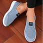 Navy blue women's slip-on mesh walking shoes from BackupMyFilesNow.com, lightweight and fashionable for easy casual wear and hiking.