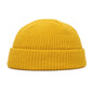Navy blue knitted beanie cap for men and women, warm wool hat with simple, trendy style for autumn and winter.