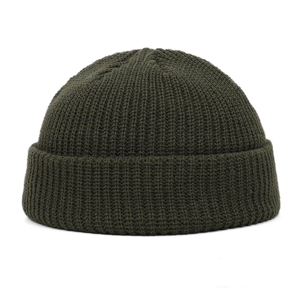 Navy blue knitted beanie cap for men and women, warm wool hat with simple, trendy style for autumn and winter wear.