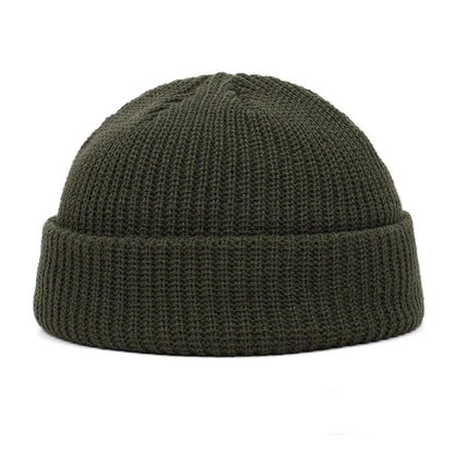Navy blue knitted beanie cap for men and women, warm wool hat with simple, trendy style for autumn and winter wear.