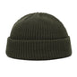 Navy blue knitted beanie cap for men and women, warm wool hat with simple, trendy style for autumn and winter wear.