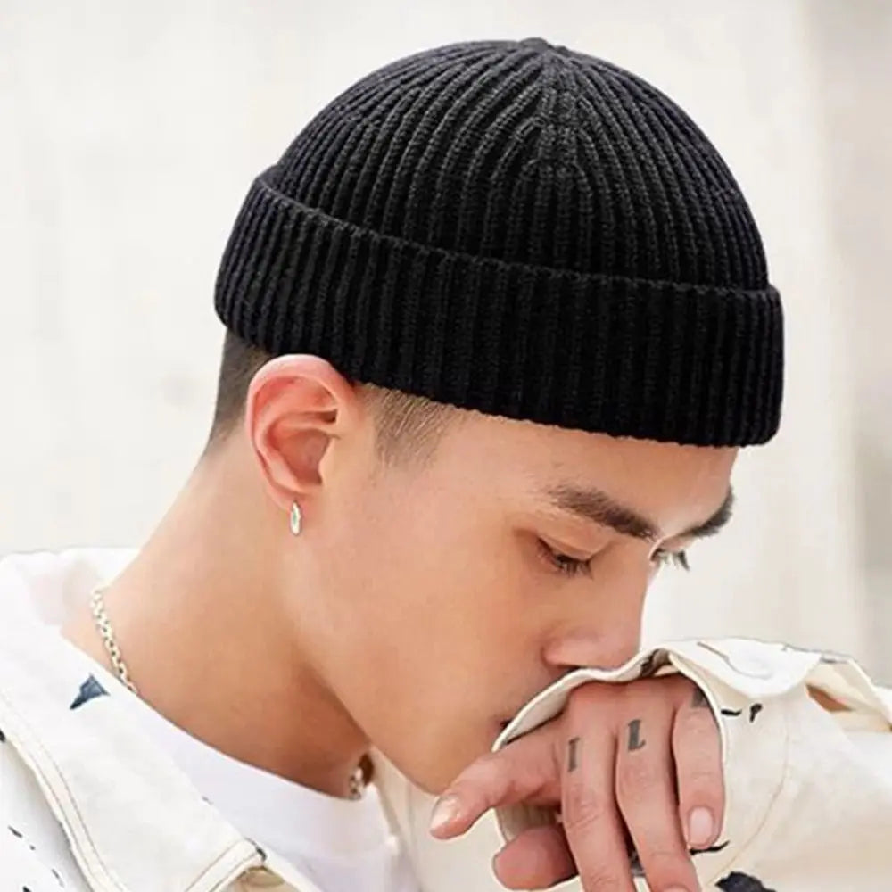 Grey unisex knitted beanie hat with a casual, elastic fit, suitable for women, men, boys, and girls in autumn and winter.