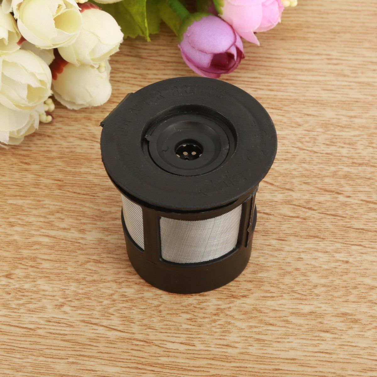 Coffee filter cup with K-Cup coffee filter accessories, black plastic design for easy brewing and reuse.