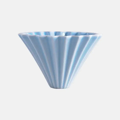 Orange ceramic hand-brewing coffee dripper with flower-shaped funnel for pour-over coffee, handmade ceramic coffee filter cup.