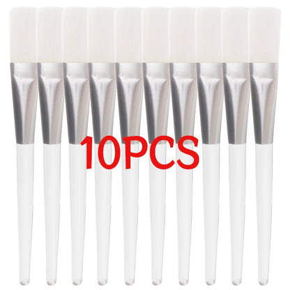 Pink beauty facial masks brushes set with soft bristles for applying face masks, makeup, and spa facial care tools.