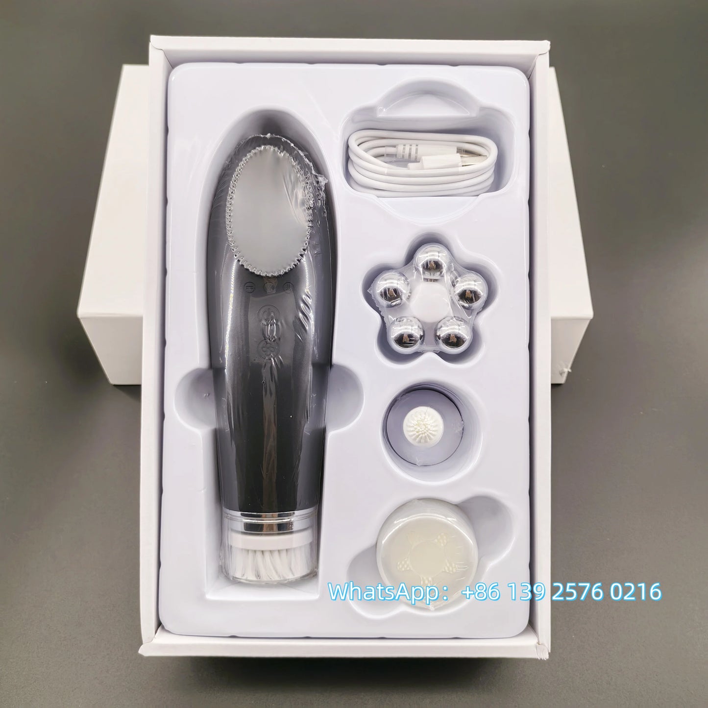 Pink BackupMyFilesNow.com 4-in-1 facial skin lifting device with electric silicone face brush for deep cleansing and skin rejuvenation.