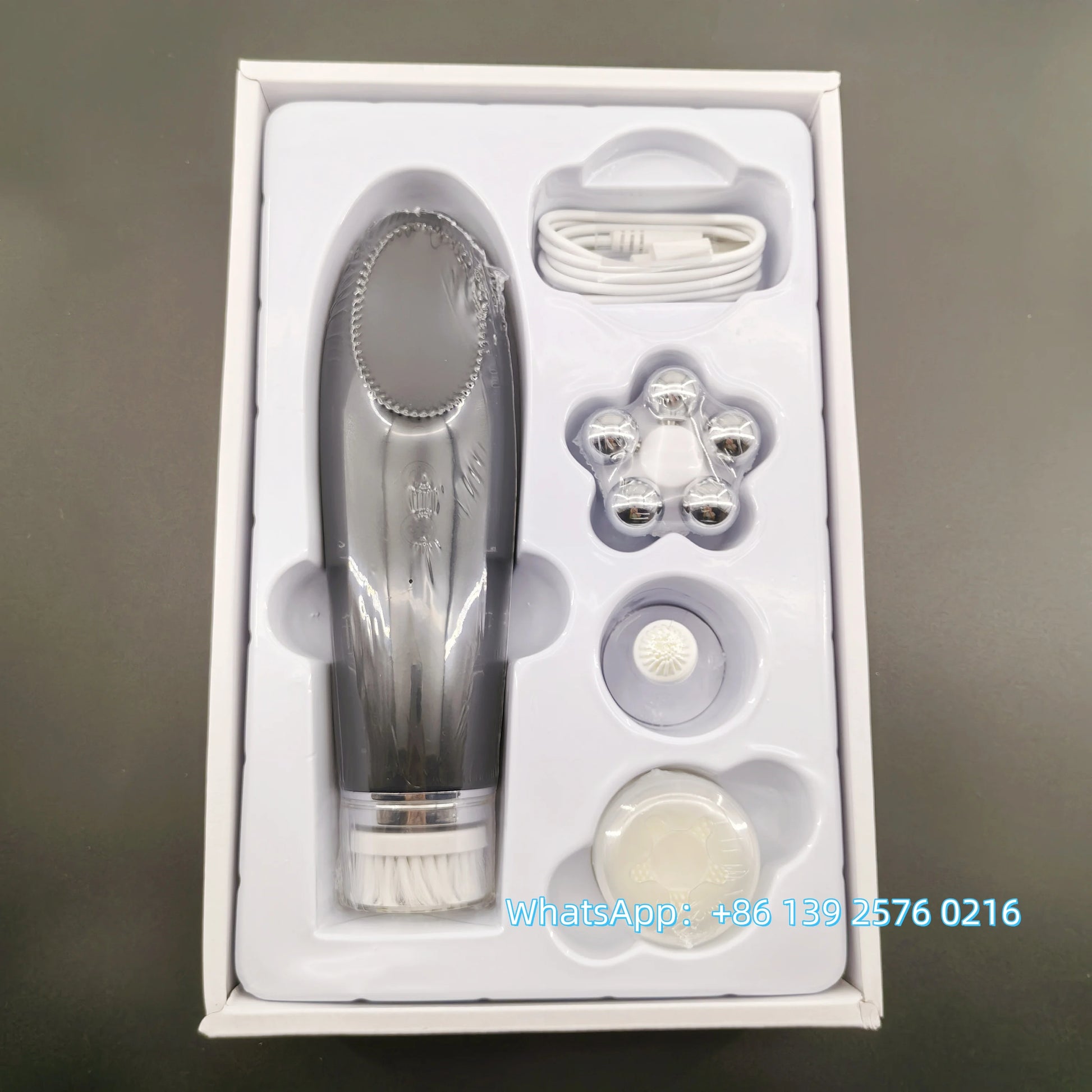 Pink Beauty 4-in-1 facial skin lifting device with electric silicone face brush for deep cleansing and skin rejuvenation.