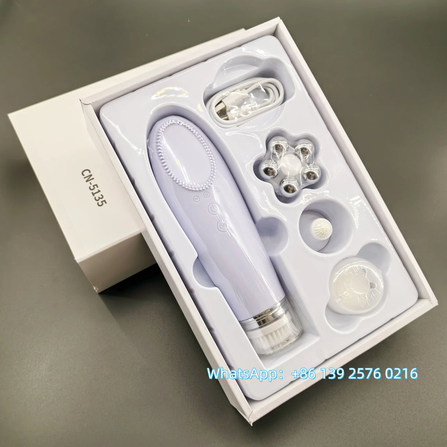 Pink BackupMyFilesNow 4-in-1 facial skin lifting device with electric silicone face brush for deep cleansing and skin rejuvenation.