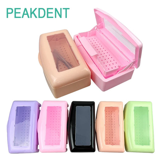 Pink dental instrument sterilizer disinfection box with manicure nail tools, tweezers, surgical pliers, and sterilizing tray.