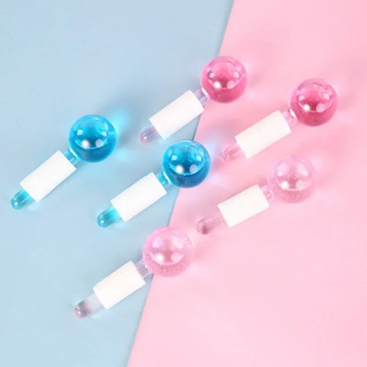 Pink crystal ice hockey beauty ball used for facial massage and ice therapy, featuring a smooth glass surface for skincare.