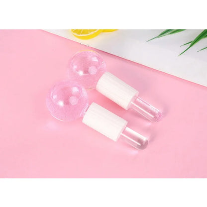 Pink crystal ice hockey beauty ball for face massage and ice therapy, made of glass for soothing skincare treatments.