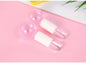 Pink crystal ice hockey beauty ball used for ice therapy and face massage, featuring a smooth glass surface for skin refreshment.