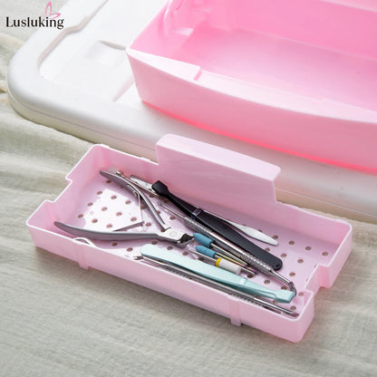 Pink sterilizing tray with manicure tools and nail tools inside a disinfection box, featuring a detachable cleaning and storage box.