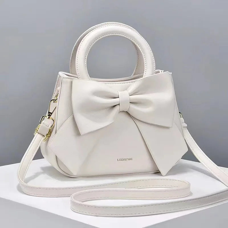 Pink versatile crossbody bag for women, stylish shoulder purse and handbag, designer luxury bag with multiple uses.