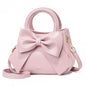 Pink versatile crossbody bag for women, stylish shoulder purse and handbag with designer luxury details.