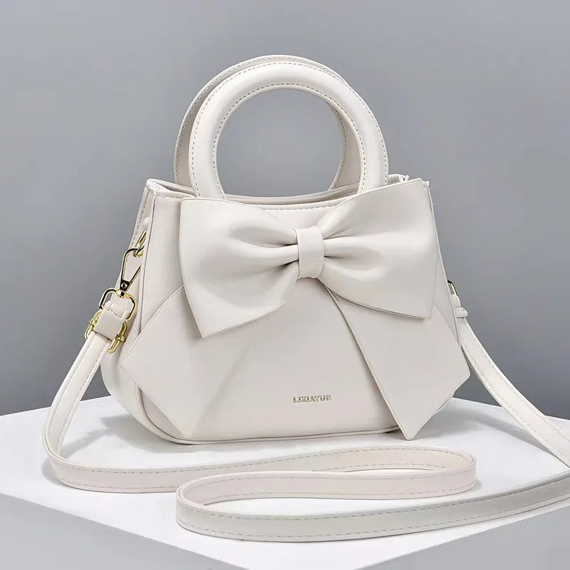 Pink versatile crossbody bag for women, designer shoulder purse and handbag with stylish, luxurious design and multiple carrying options.
