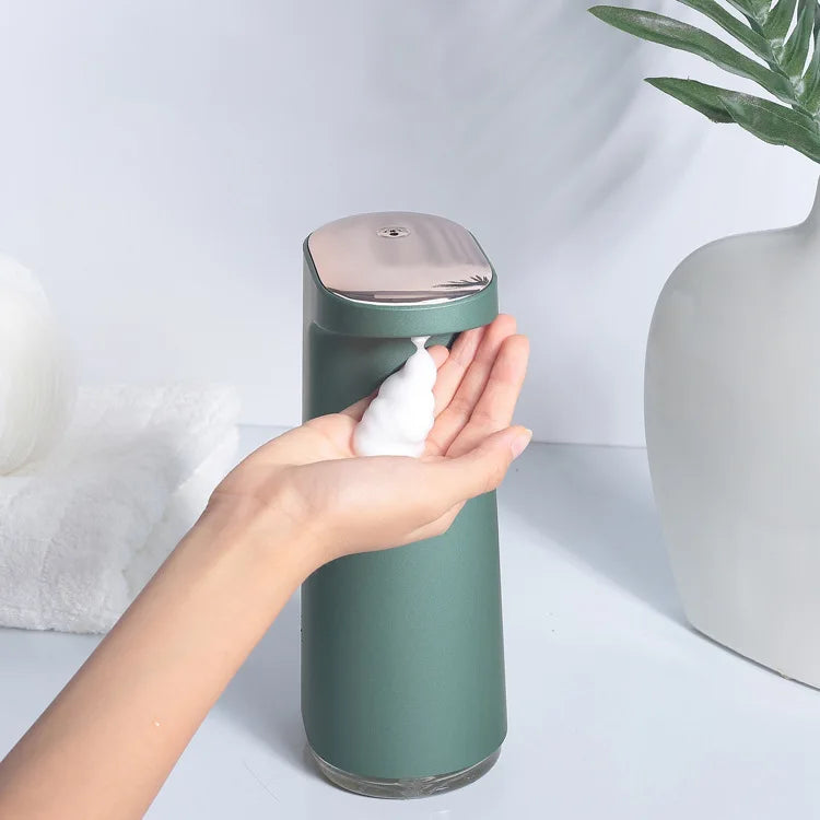 Pink rechargeable automatic soap dispenser for foaming hand soap, featuring touchless operation and sleek modern design.