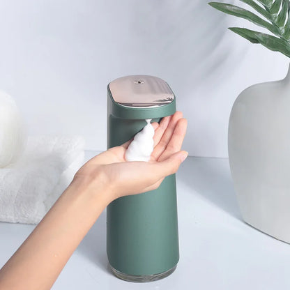 Pink rechargeable automatic soap dispenser for foaming hand soap, featuring touchless operation and sleek modern design.