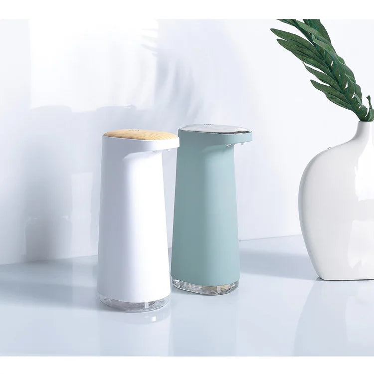 Pink rechargeable automatic foaming hand soap dispenser from BackupMyFilesNow.com, with touchless operation and sleek design.