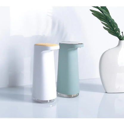 Pink rechargeable automatic foaming hand soap dispenser from BackupMyFilesNow.com, with touchless operation and sleek design.