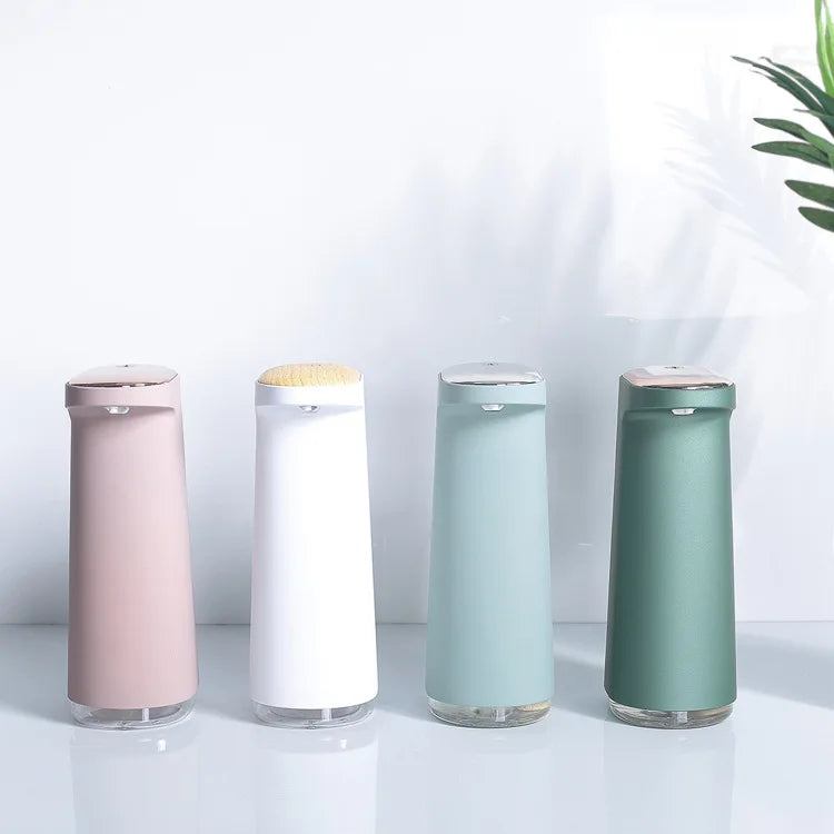 Pink rechargeable automatic soap dispenser for foaming hand soap from BackupMyFilesNow.com, with touchless operation and sleek design.