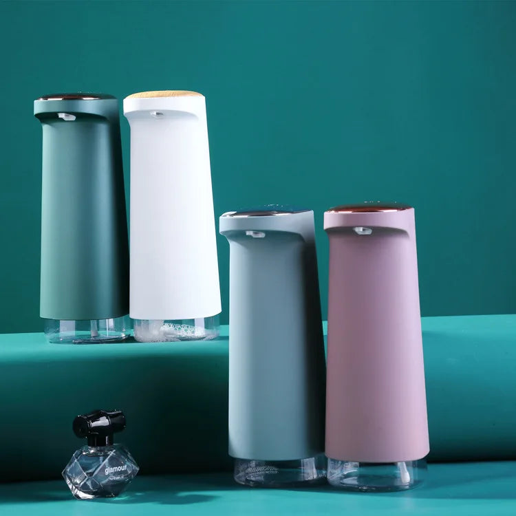 Pink rechargeable automatic soap dispenser by BackupMyFilesNow.com for foaming hand soap, with touchless operation and sleek design.