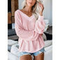 Loose V-neck knit sweater with plaid design from BACKUPMYFILESNOW.COM® displayed on a model.