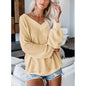 Loose V-neck knit sweater with plaid design in neutral tones, from BACKUPMYFILESNOW.COM®.
