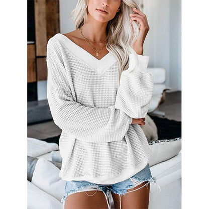 Loose V-neck knit sweater with plaid design from BACKUPMYFILESNOW.COM®, shown in a cozy, casual fit with ribbed cuffs and hem.