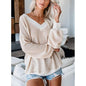 Loose V-neck knit sweater with plaid design from BACKUPMYFILESNOW.COM®, featuring a cozy, casual fit and stylish pattern.