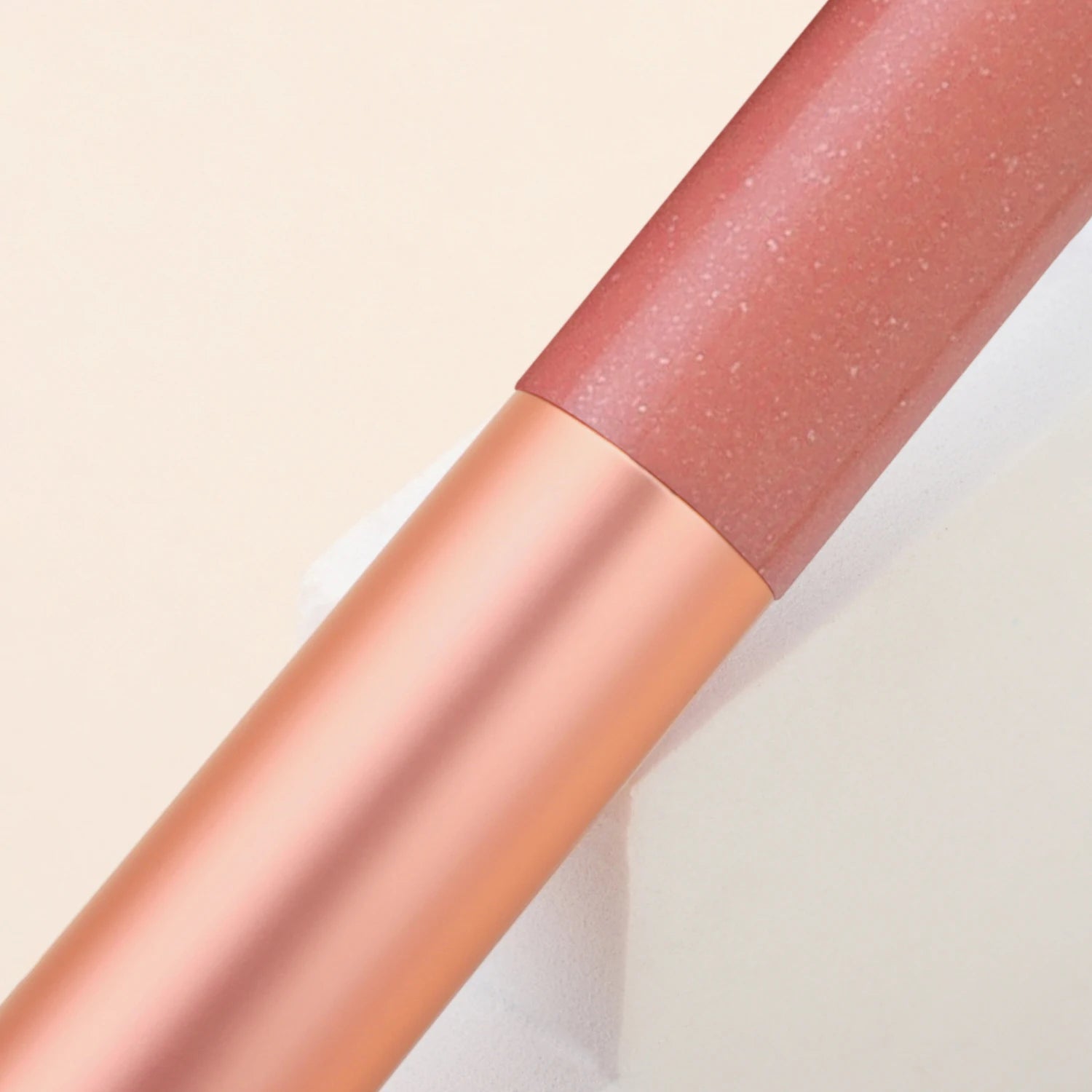 Pink facial brightening and contouring brush by BackupMyFilesNow.com, designed for precise makeup application and skin highlighting.