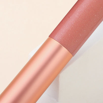 Pink facial brightening and contouring brush by BackupMyFilesNow.com, designed for precise makeup application and skin highlighting.