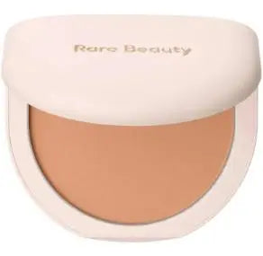 Rare Beauty liquid blush in porcelain shade, silky smooth, easy to blend, high-gloss finish, enhancing makeup texture.