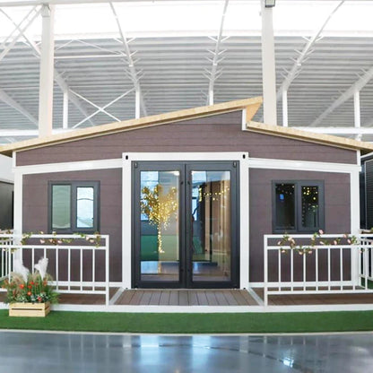 Custom brown modular shipping container house by BACKUPMYFILESNOW.COM®, showcasing a foldable prefab mobile villa with windows and doors.