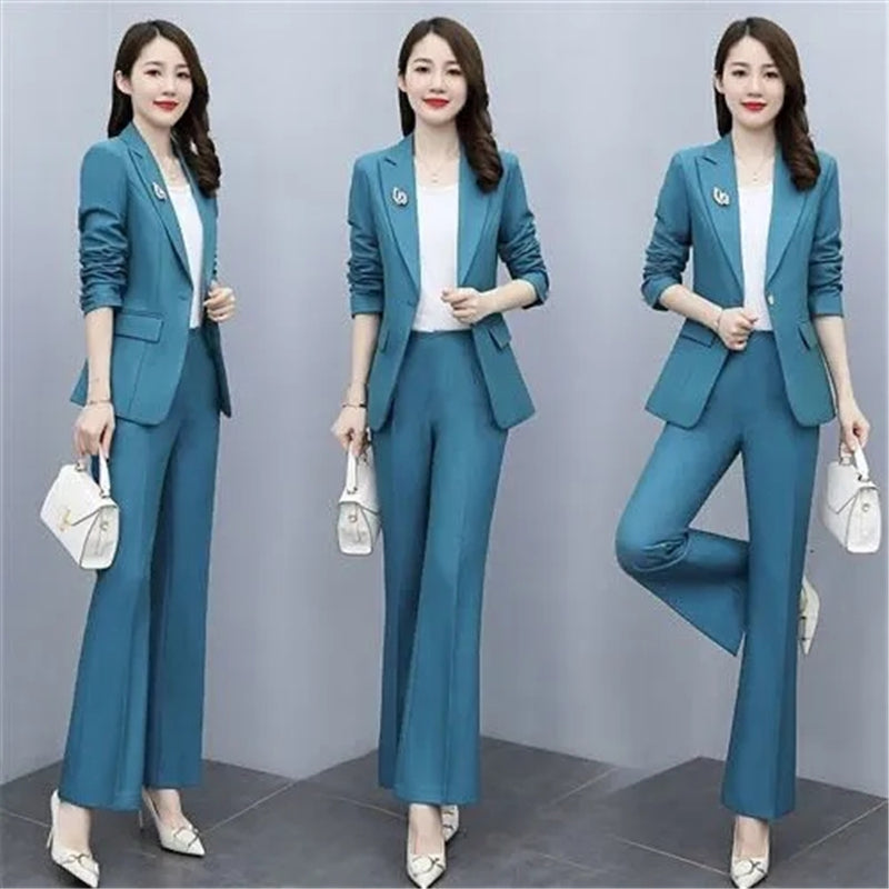 Elegant women's office suit in purple, featuring a tailored blazer and matching trousers, ideal for professional work attire.