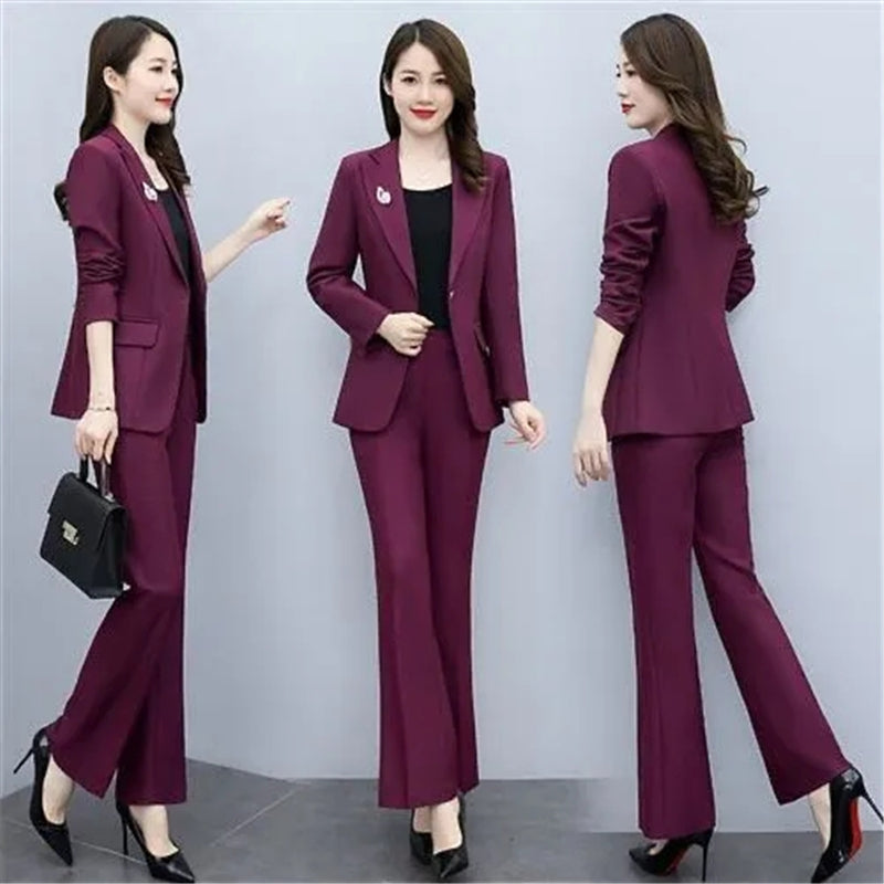 Elegant women's purple office suit for work, featuring tailored blazer and matching pants, suitable for professional attire.
