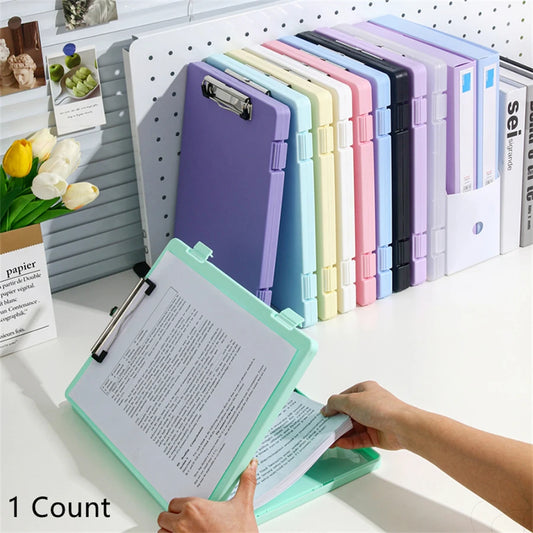Purple A4 multi-functional file folder from BackupMyFilesNow.com holding test papers, office documents, and writing materials.