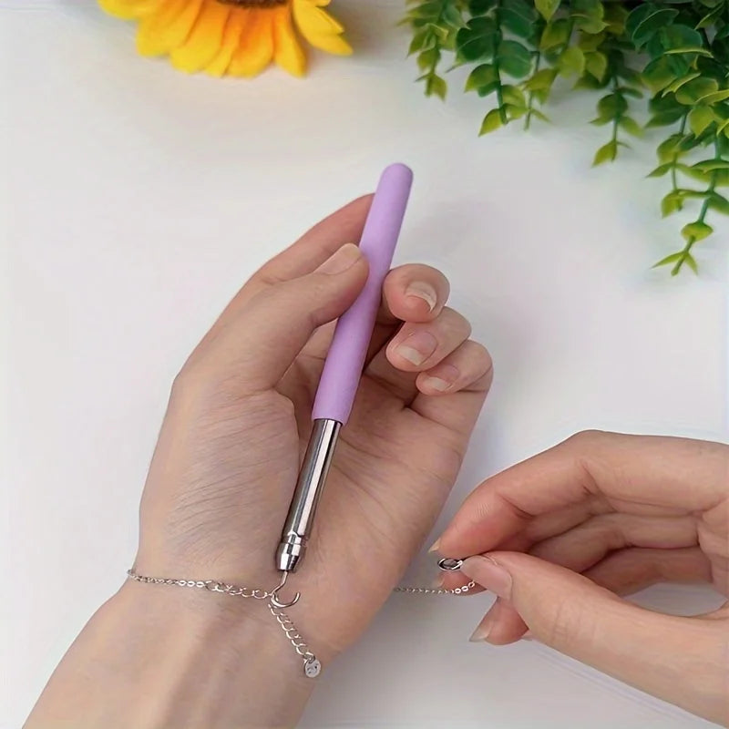 Purple Help Wear Bracelet Tool for unfastening jewelry, clasps, zippers, and craft tying equipment with pliers and hooking aid.