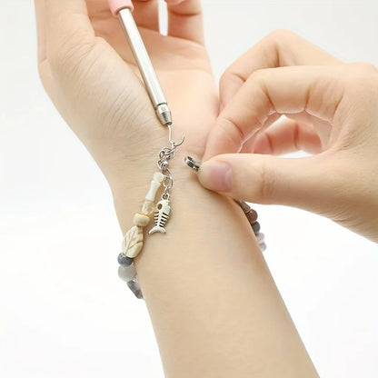 Purple Help Wear Bracelet Tool for jewelry fastening, unfastening, and clasp adjustment with pliers and hooking equipment.