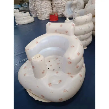 Inflatable baby chair in rainbow colors for dining and bath, designed for infants' comfort and safety.