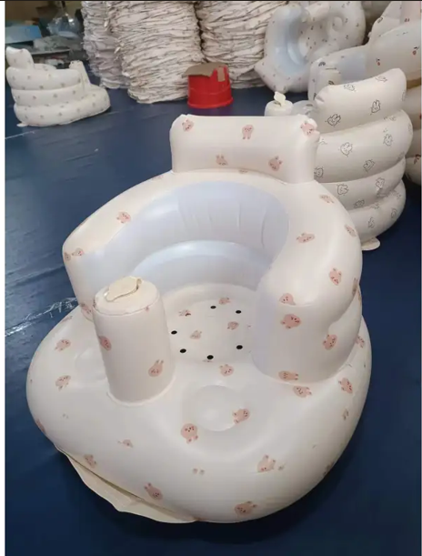 Inflatable baby chair for dining and bath with rainbow colors, designed for comfort and safety during feeding and bathing.