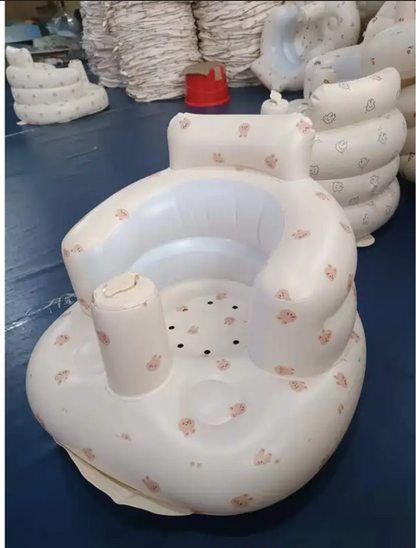 Inflatable baby chair for dining and bath with rainbow colors, designed for comfort and safety during feeding and bathing.