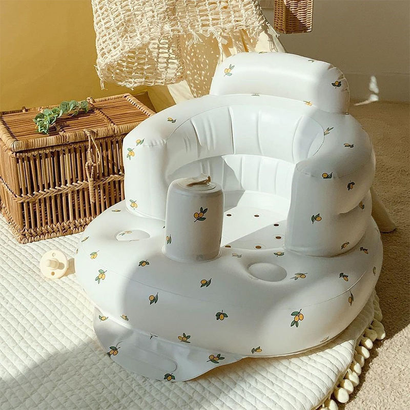 Inflatable baby chair for dining and bath with rainbow design, made by BackupMyFilesNow.com, suitable for infants.